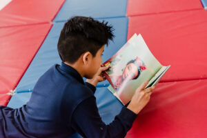 A little boy reading a book